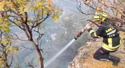 Makilikte çıkan yangın bahçelere ulaşmadan söndürüldü
